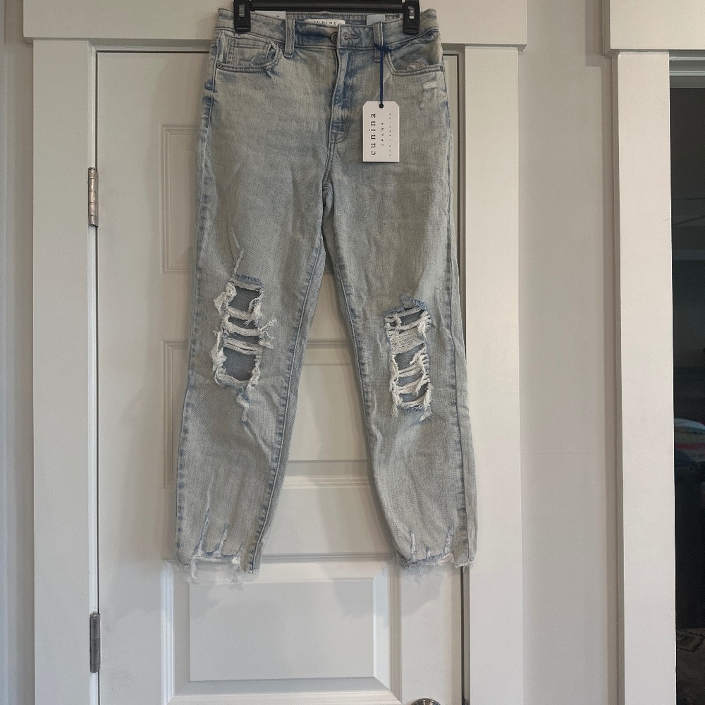 Distressed never warm wholes in knees distressed bottom skinny jeans